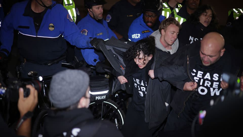 Members of US Capitol Police pull protesters away from the DNC headquarters on Wednesday. - Alex Wong/Getty Images