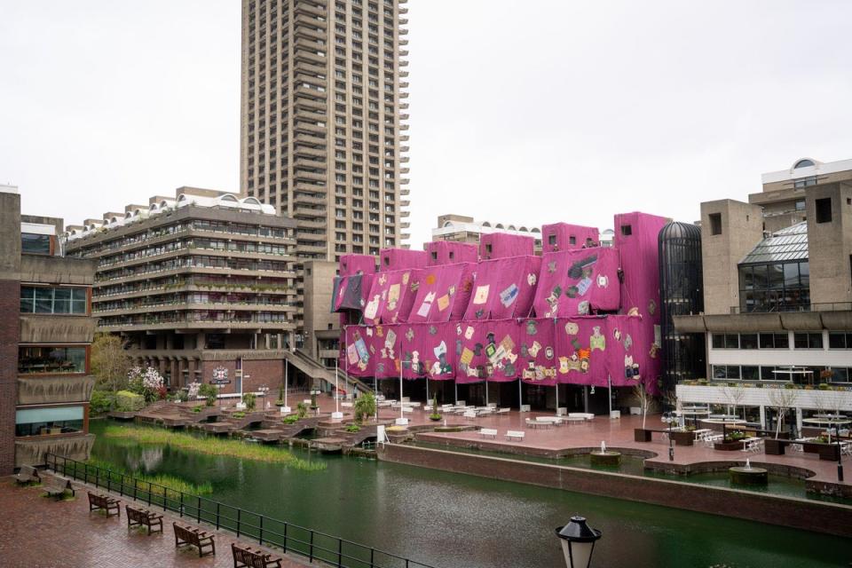 Ibrahim Mahama’s Purple Hibiscus during installation at the Barbican, 2024 (Courtesy Ibrahim Mahama, Red Clay Tamale, Barbican Centre, London and White Cube.  © Pete Cadman, Barbican Centre)