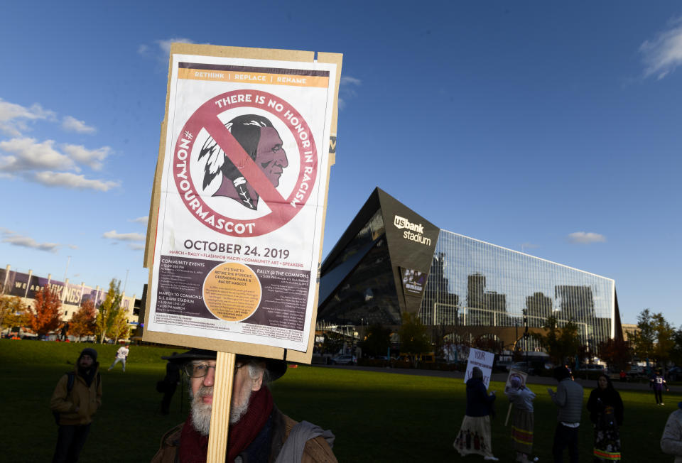 Protestors gathered outside of the Vikings home stadium to pressure owner Dan Snyder to change the Redskins name and mascot. (Stephen Maturen/Getty Images)