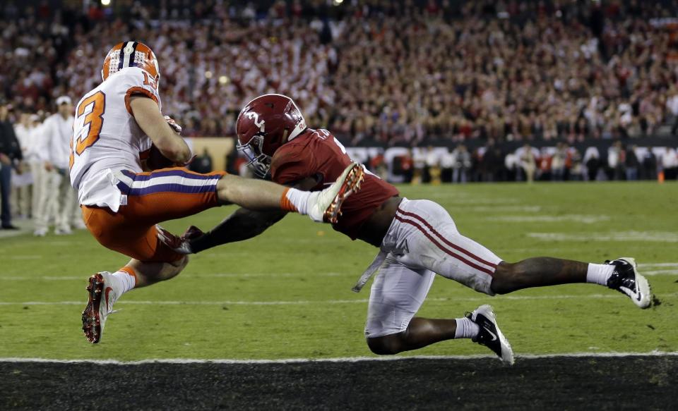 Clemson's Hunter Renfrow catches a touchdown pass in front of Alabama's Tony Brown during the second half of the NCAA college football playoff championship game Tuesday, Jan. 10, 2017, in Tampa, Fla. (AP Photo/David J. Phillip)