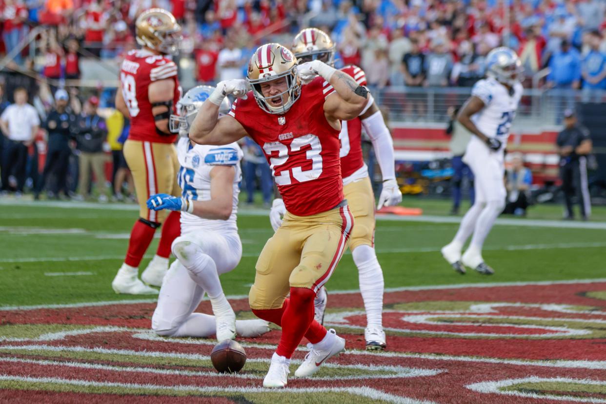 San Francisco 49ers' running back Christian McCaffrey (23) reacts after scoring a touchdown against the Detroit Lions in the second quarter of the NFC Championship NFL football game in Santa Clara, Calif., Sunday, Jan. 28, 2024. (Carlos Avila Gonzalez/San Francisco Chronicle via AP)