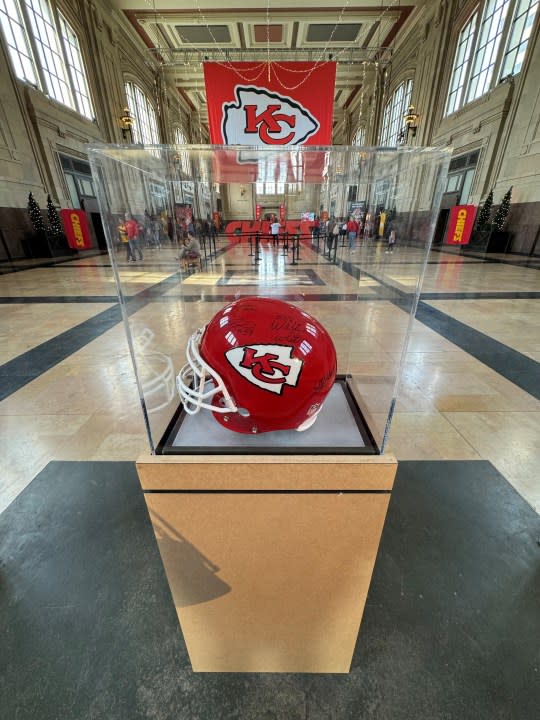 A signed Chiefs helmet on display at Union Station in Kansas City before Super Bowl LVIII. (FOX4 photo)