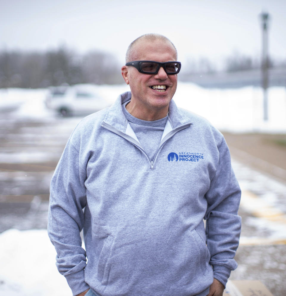 Thomas Rhodes smiles as he walked out of a Minnesota state prison on Friday, Jan. 13, 2023, in Moose Lake, Minn. Rhodes had been convicted of murder in the 1996 death of his wife and had served 25 years before authorities vacated his murder conviction on Friday, citing flawed testimony from an expert witness. He instead pleaded guilty to manslaughter on Friday and got credit for time served. (Fong Lee via AP)