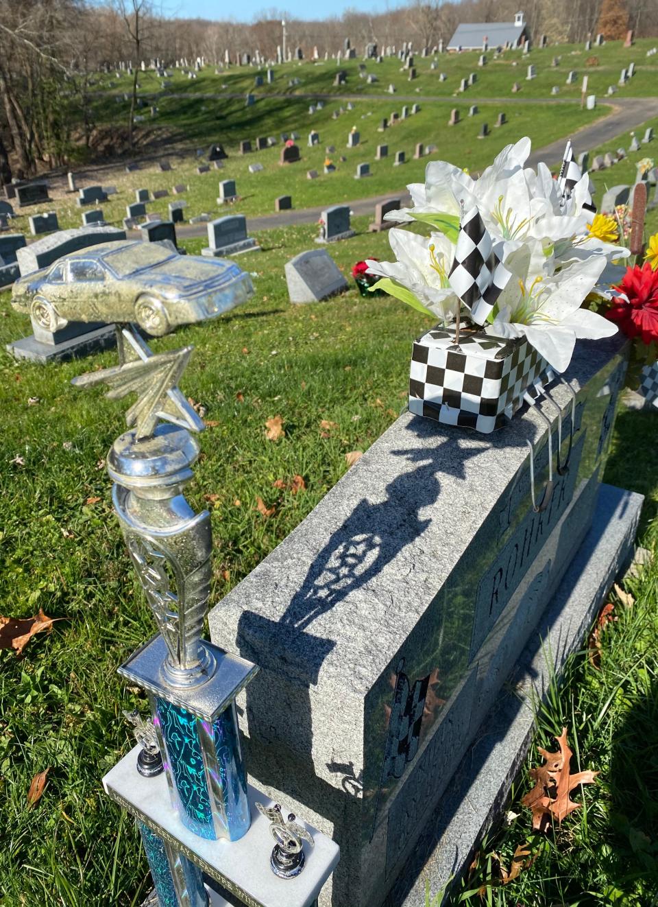 A gravesite at Melscheimer Cemetery in Pike Township displays personal touches and keepsakes in this Canton Repository file photo from 2020.
