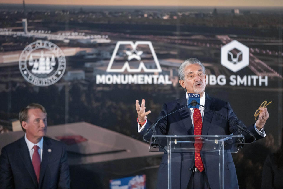 FILE - Ted Leonsis, owner of the Washington Wizards NBA basketball team and Washington Capitals NHL hockey team, speaks during an event with Virginia Gov. Glenn Youngkin, seated left, to announce plans for a new sports stadium for the teams, Wednesday, Dec. 13, 2023, in Alexandria, Va. A leading Democratic Virginia legislator says proposed legislation to help pave the way for the NBA's Washington Wizards and NHL's Washington Capitals to relocate to northern Virginia is dead. Sen. L. Louise Lucas holds great sway in the General Assembly as chair of the Senate Finance & Appropriations Committee. She told reporters Monday morning, Feb. 12, 2024, that Republican Gov. Glenn Youngkin had made a series of mistakes in trying to advance the deal through a General Assembly now in full Democratic control after November's elections. (AP Photo/Alex Brandon, File)