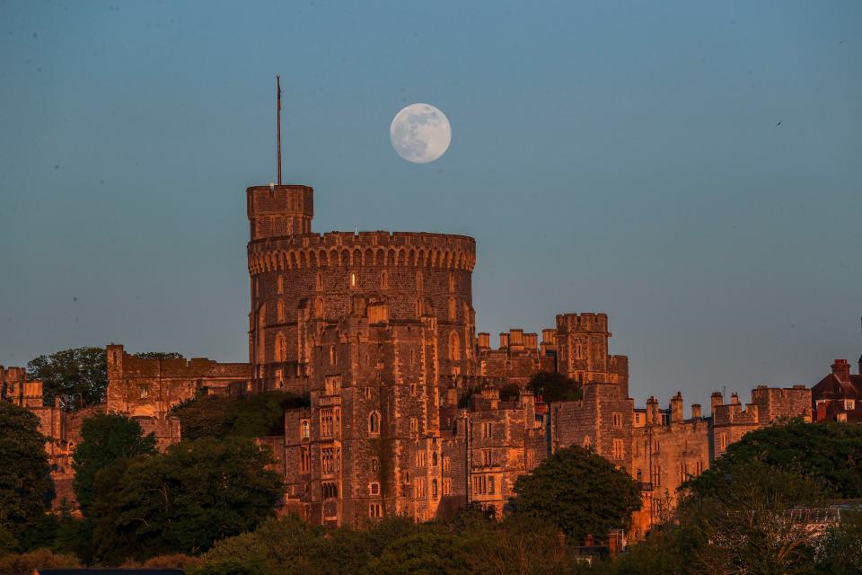 <p>A Supermoon rises above Windsor Castle last year</p> (PA)