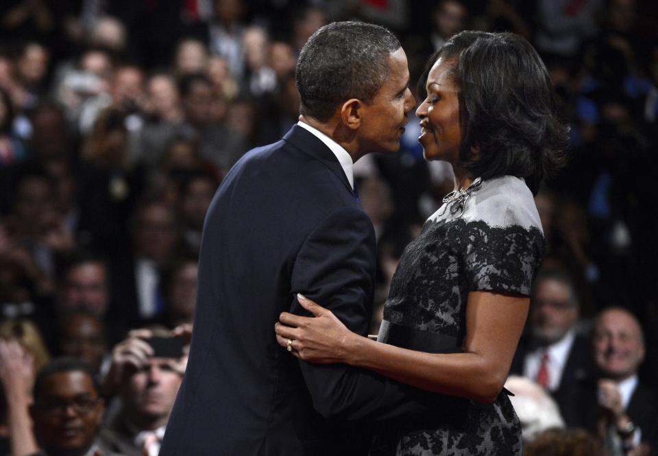 President Barack Obama and First lady Michelle Obama kiss after the third presidential debate at Lynn University, Monday, Oct. 22, 2012, in Boca Raton, Fla. (AP Photo/Pool-Michael Reynolds)