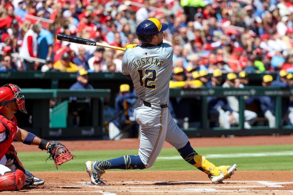 Rhys Hoskins hits a two-run homer during the first inning against the Cardinals on Saturday. Hoskins was one of three Brewers to hit a home run in the game, and Milwaukee had 18 hits overall.