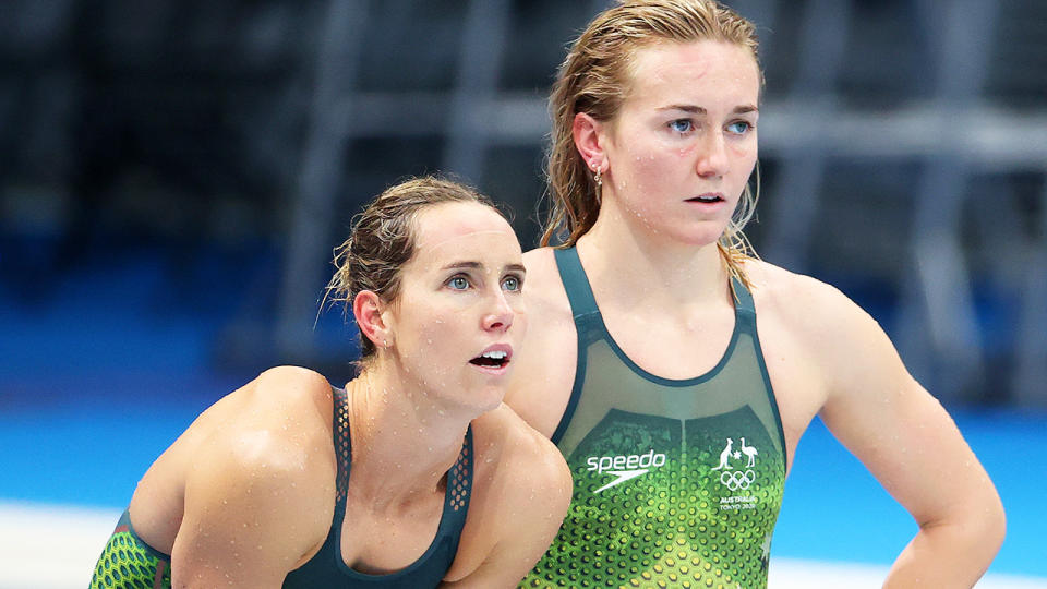 Emma McKeon and Ariarne Titmus watch on during the womens' 4x200m freestyle relay at the Tokyo Olympics. (Photo by Abbie Parr/Getty Images)