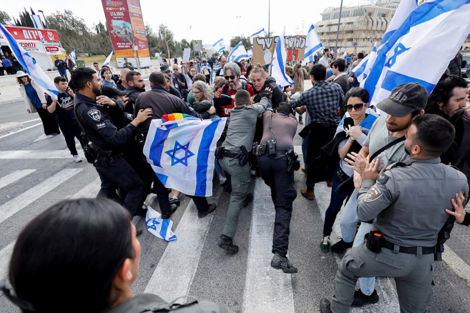 <div class="inline-image__caption"><p>Demonstrators clash with police officers during the "Day of Resistance" protest as Israeli Prime Minister Benjamin Netanyahu's nationalist coalition government presses on with its contentious judicial overhaul, in Jerusalem, March 9, 2023.</p></div> <div class="inline-image__credit">Ammar Awad/Reuters</div>