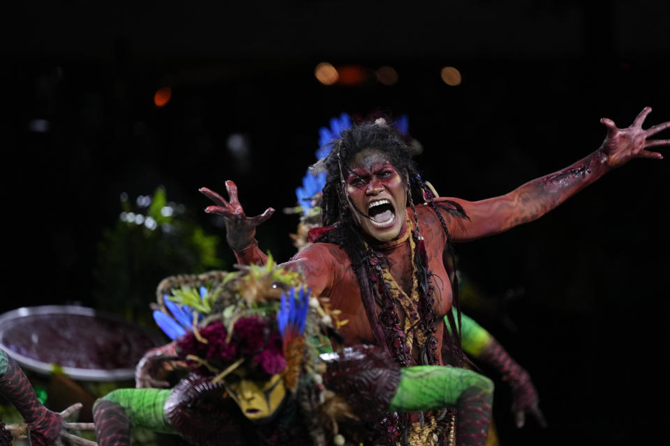 A performer from the Salgueiro samba school parades during Carnival celebrations at the Sambadrome in Rio de Janeiro, Brazil, Monday, Feb. 12, 2024. (AP Photo/Silvia Izquierdo)