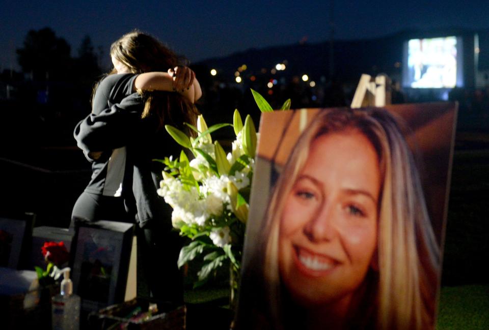 Mourners hug at the memorial service for Katie Meyer at Newbury Park High School on March 12. The beloved former Newbury Park High soccer goalie died by suicide in March while a student at Stanford University.