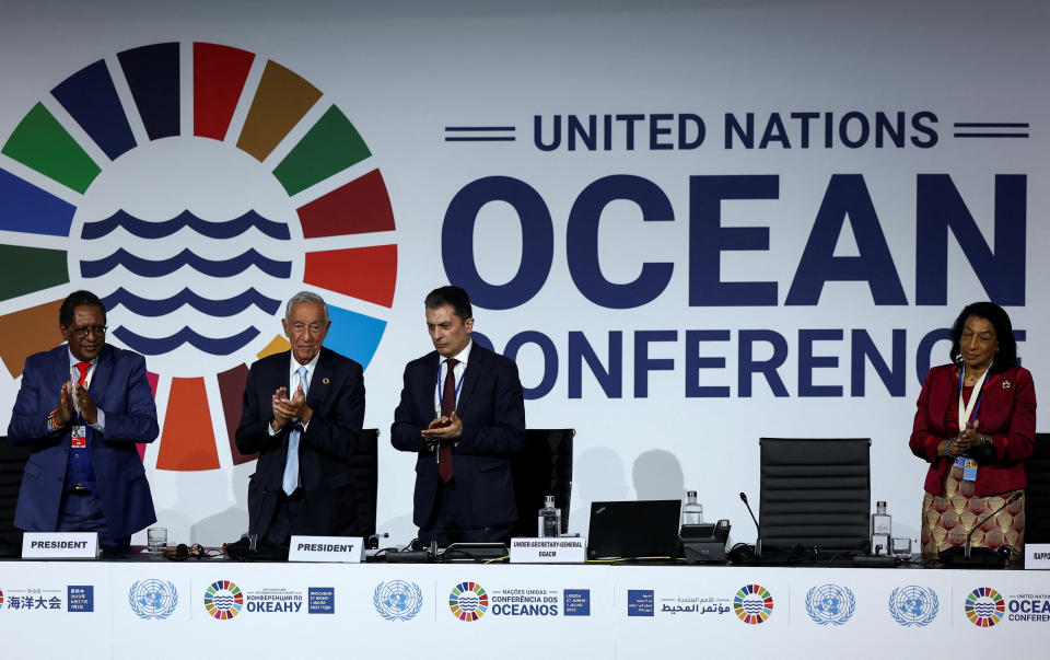 Marcelo Rebelo de Sousa, Portugal's President, and Keriako Tobiko, Kenya's Cabinet Secretary for the Ministry of Environment and Forestry, applaud during the closing of 2022 UN Ocean Conference in Lisbon, Portugal, July 1, 2022. REUTERS/Rodrigo Antunes