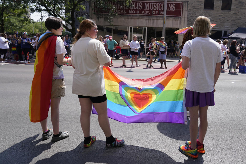 People watch the Pride Parade, Saturday, June 10, 2023, in Indianapolis. (AP Photo/Darron Cummings)