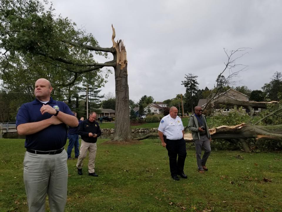 Stark County Emergency Management Agency Director Tim Warstler, left, tours the part of Lake Cable that was believed to have been struck by a tornado on Oct. 21. Days later it was classified an F1.  He is shown here with, right to left, National Weather Service Meteorologist Freddie Zeigler, Jackson Township Police Maj. Jim Monigold, Jackson Township Fire Chief Tim Berczik and EMA Deputy Director Doug Wood.