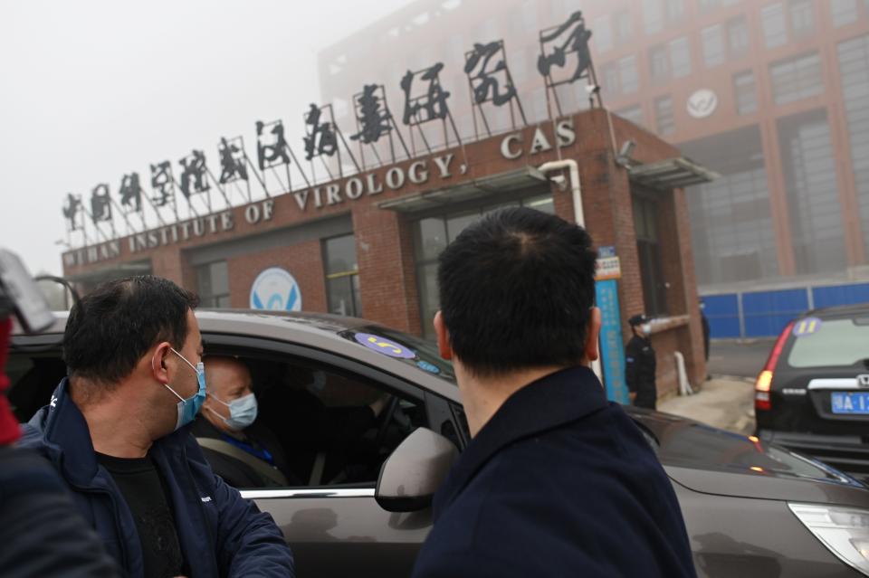 Members of the World Health Organization team investigating the origins of the COVID-19 virus arrive at the Wuhan Institute of Virology in  February 2021.