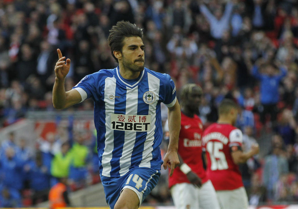 Wigan Athletic's Jordi Gomez celebrates his penalty goal against Arsenal during their English FA Cup semifinal soccer match at Wembley Stadium in London, Saturday, April 12, 2014. (AP Photo/Sang Tan)