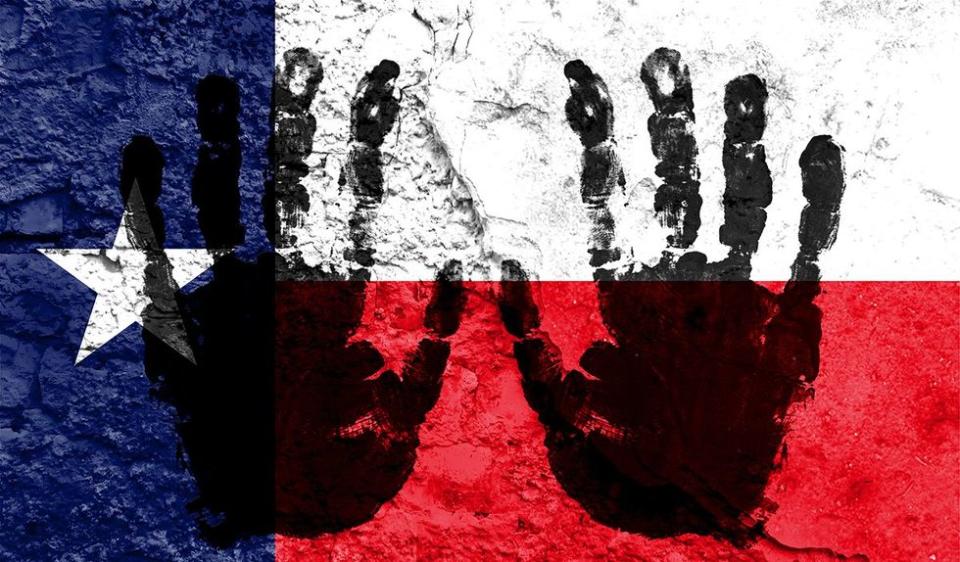 horrific reality transgender people Texas prison system state flag handprints wall