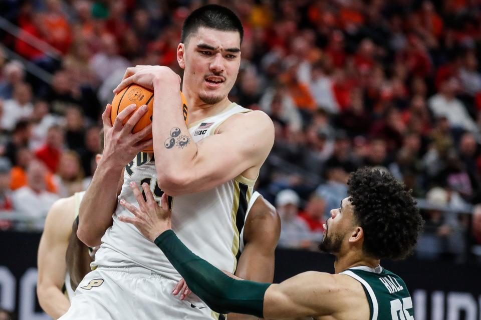 Purdue center Zach Edey (15) grabs a rebound against Michigan State forward Malik Hall (25) during the second half of quarterfinal of Big Ten tournament at Target Center in Minneapolis, Minn. on Friday, March 15, 2024.