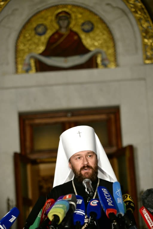 Bishop Hilarion talks to reporters after the Holy Synod