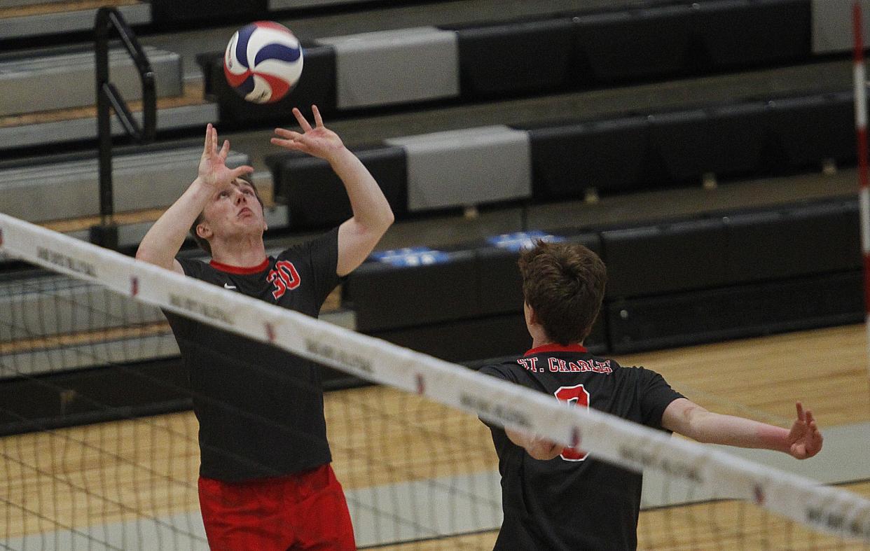 Miller Kuntz sets the ball for Isaac Feeny during St. Charles' 25-15, 25-20, 21-25, 25-15 loss to DeSales in the Division II East Region final May 28 at Westerville Central.