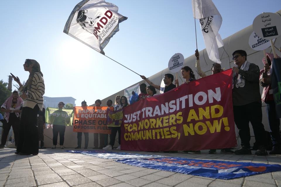 Activists demonstrate during the COP28 U.N. Climate Summit, Saturday, Dec. 9, 2023, in Dubai, United Arab Emirates. (AP Photo/Kamran Jebreili)