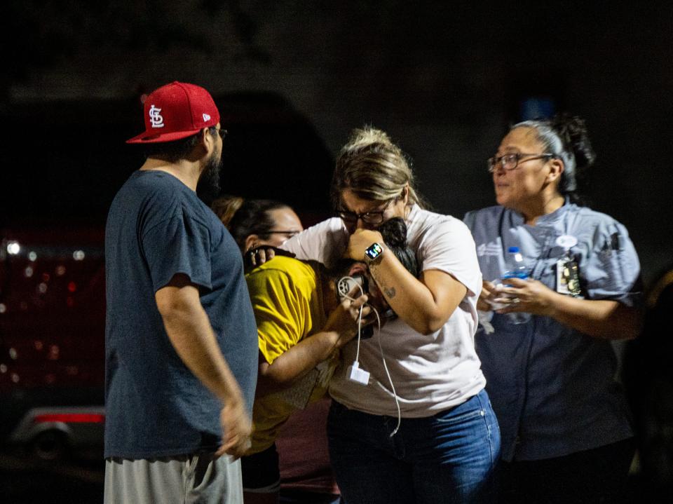 A family grieves outside of the SSGT Willie de Leon Civic Center following the mass shooting at Robb Elementary School on May 24, 2022 in Uvalde, Texas.