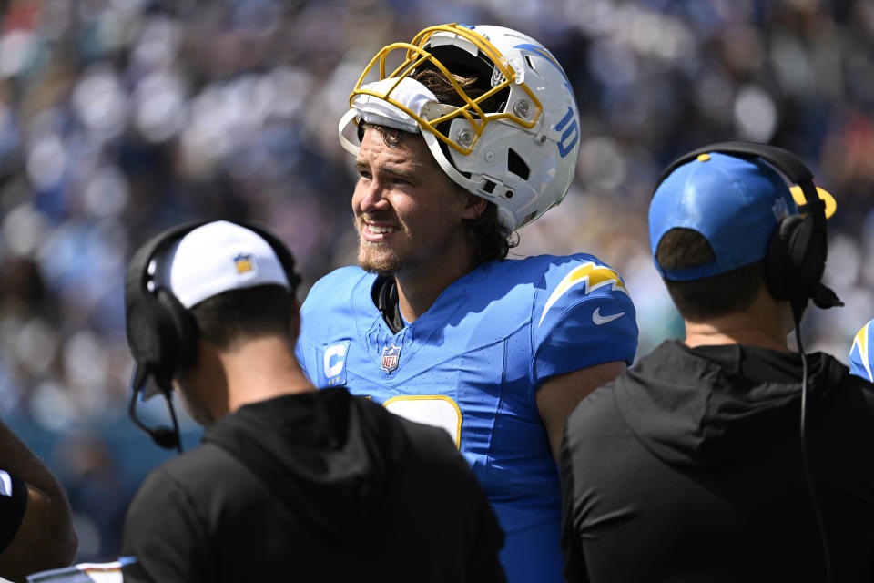 Los Angeles Chargers quarterback Justin Herbert stands on the sideline during the first half of an NFL football game against the Tennessee Titans Sunday, Sept. 17, 2023, in Nashville, Tenn. (AP Photo/John Amis)