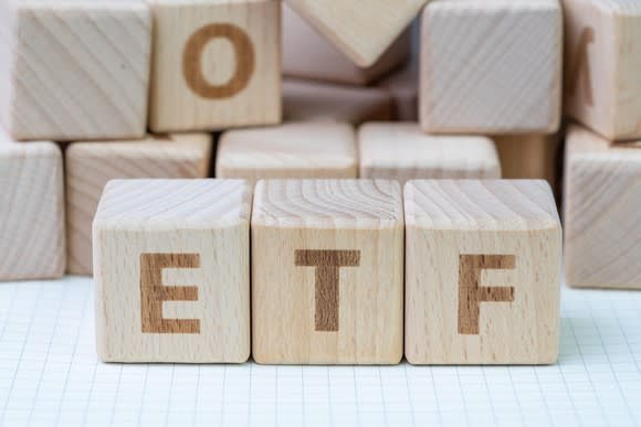 Wooden blocks spelling out ETF