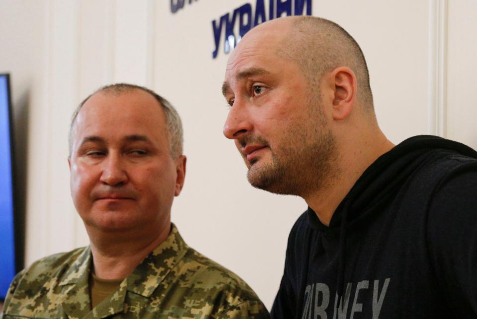 Russian journalist Arkady Babchenko (R) and Vasily Gritsak, head of the Ukrainian Security Service, speaks to the media during a news conference at the Ukrainian Security Service on May 30, 2018 in Moscow