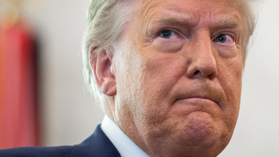 President Trump looks on during a ceremony presenting the Presidential Medal of Freedom to wrestler Dan Gable in White House in Washington, DC on December 7, 2020. (Photo by SAUL LOEB/AFP via Getty Images)