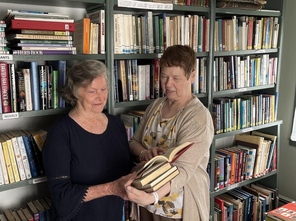 Virginia Woolley (left), founder of the Wainright House Museum and Linda Scott in the new library.