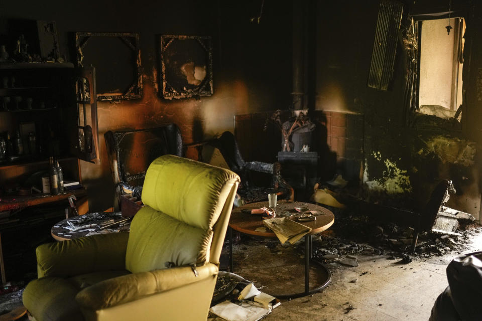 Destroyed furniture and charred walls are seen in a home that came under attack during a massive Hamas invasion into Kibbutz Nir Oz, Israel, Thursday, Oct. 19, 2023. The small farming community in the south of Israel was overrun by Hamas fighters from the nearby Gaza Strip who killed 1,400 Israelis and captured dozens of others on Oct. 7. (AP Photo/Francisco Seco)