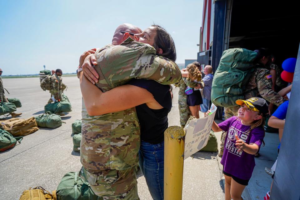 Indiana National Guard soldiers from the 163rd Field Artillery Regiment, headquartered in Evansville, are greeted by family members upon returning home from their deployment in Iraq on Thursday, Aug.3, 2023, near the Indianapolis International Airport.