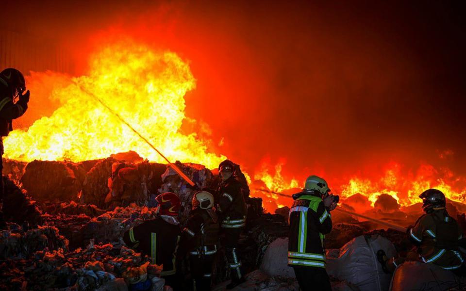  Firefighters battle a fire following Russian missile attacks in Zaporizhzhia - MEGA