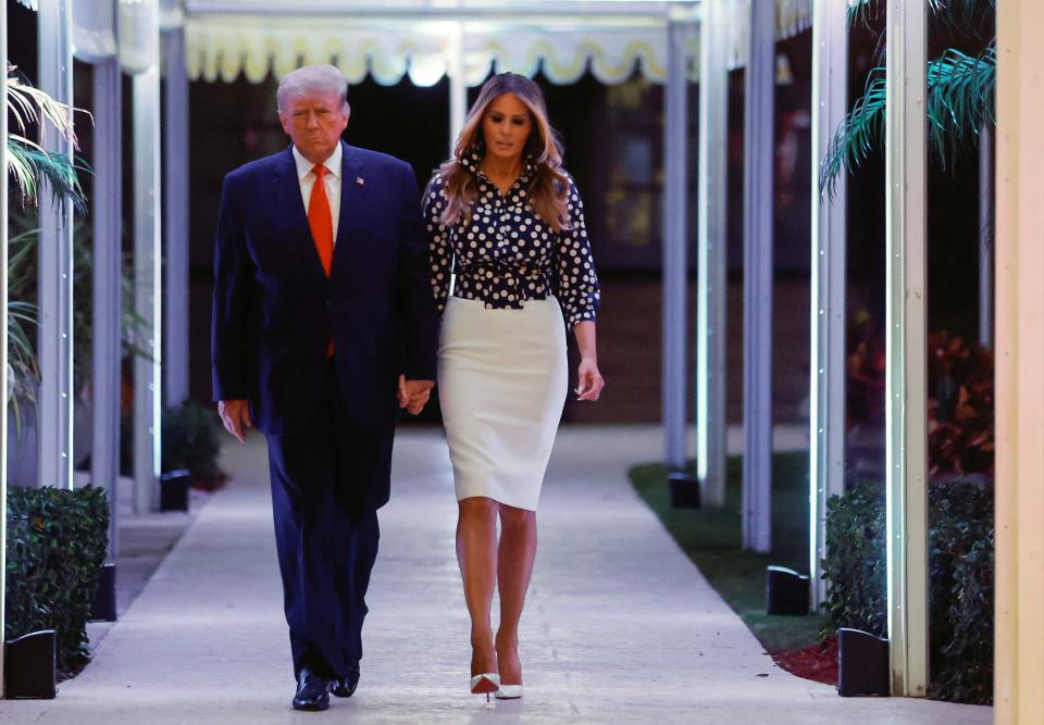 Donald and Melania Trump walk toward his Mar-a-Lago announcement on November 15, 2022.