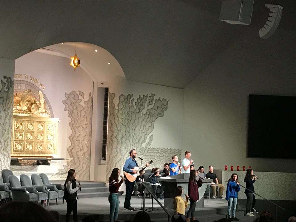 A file photo of a vigil inside Temple Israel in West Bloomfield after an October 2018 attack on a Pittsburgh synagogue. Teenagers helped lead the service, calling for an end to hate and violence. The temple is one of the biggest Reform congregations in the U.S.