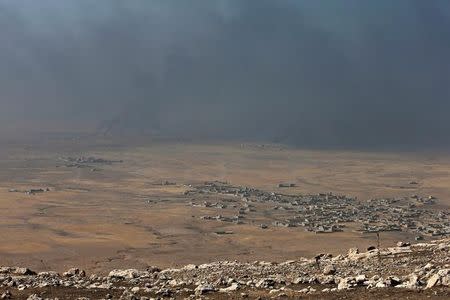 Smoke rises from clashes in the east of Mosul during clashes with Islamic State militants in Mosul, Iraq, October 17, 2016. REUTERS/Azad Lashkari