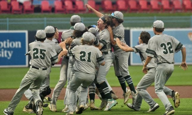 Oakmont Regional players celebrate after outlasting Medfield, 5-3, in 12 innings for the Division 3 state baseball title at Polar Park.