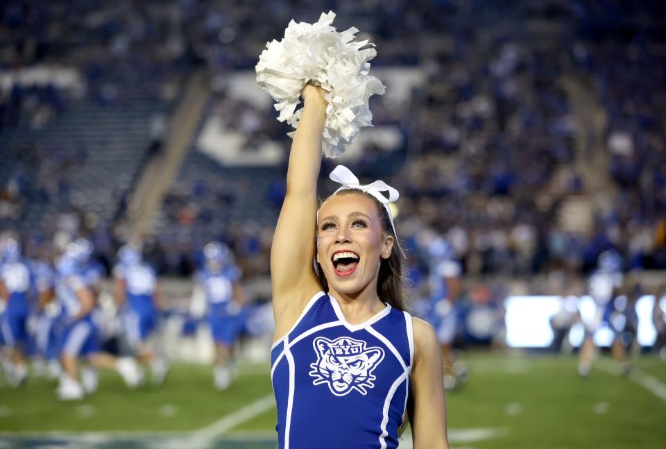 A BYU cheerleader cheers before the Brigham Young Cougars play the Cincinnati Bearcats at LaVell Edwards Stadium in Provo on Friday, Sept. 29, 2023. | Kristin Murphy, Deseret News