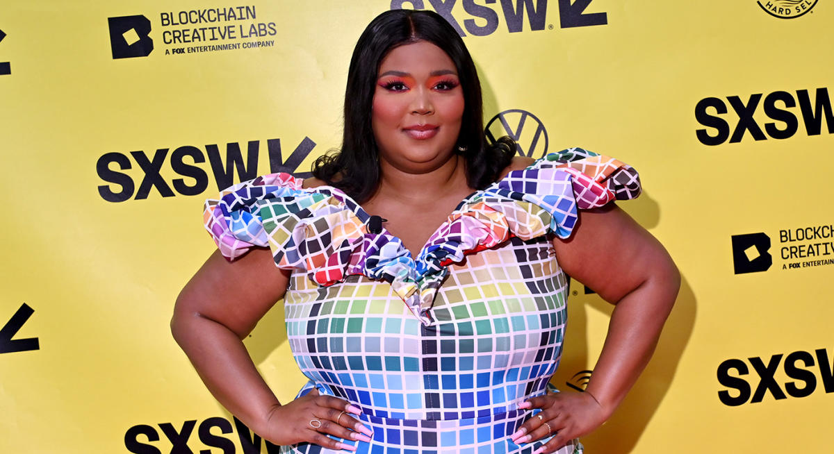 Lizzo wears cut-out leggings from new shapewear line to excitement