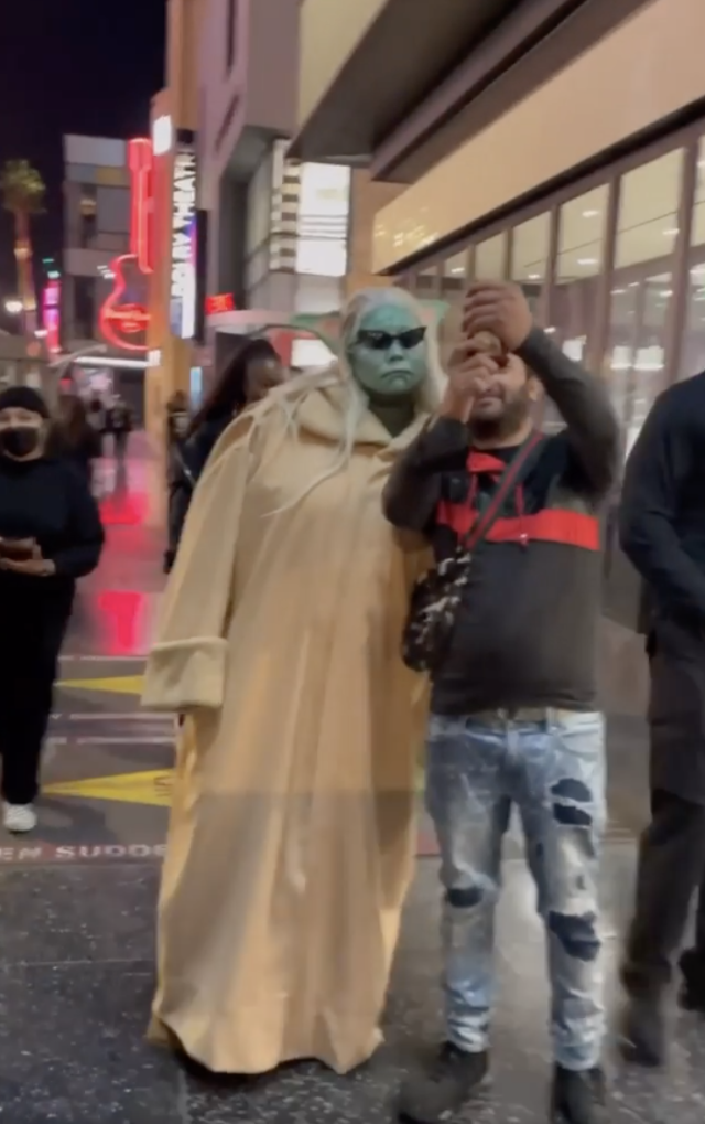 Lizzo dresses as Baby Yoda for Halloween, gives cameras Jedi hand wave