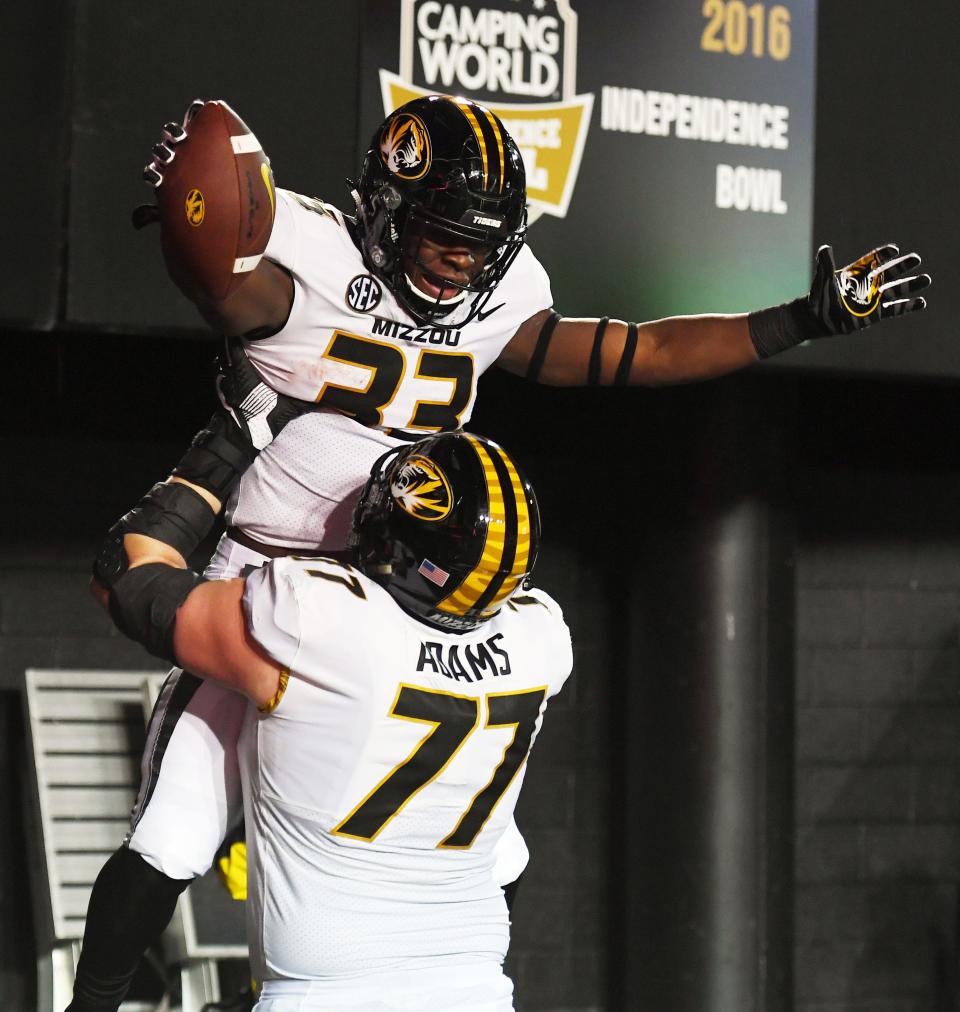 Missouri running back Larry Rountree III (33) celebrates with offensive lineman Paul Adams (77) after a touchdown against Vanderbilt on Nov. 18, 2017, at Vanderbilt Stadium in Nashville, Tenn.