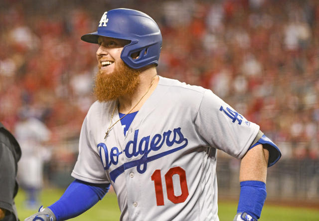 New York Mets Justin Turner runs to first base as he drives in 2 runs with  a single in the eighth inning against the Los Angeles Dodgers at Citi Field  in New