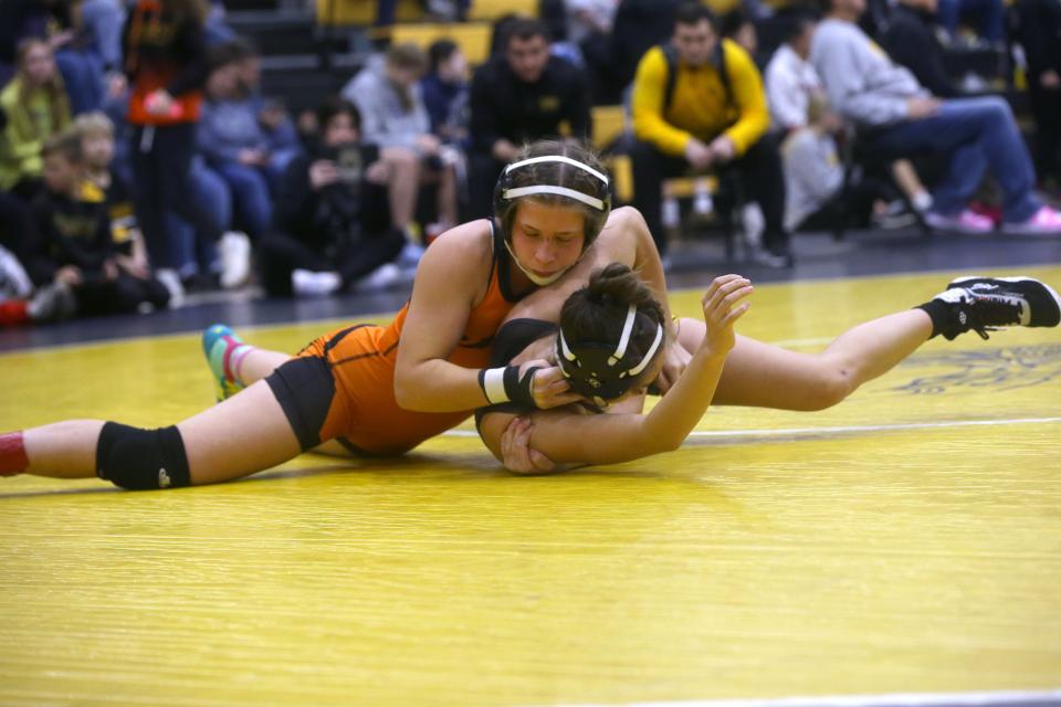 Bettendorf’s Lexy Petersen wrestles Ridge View’s Tatum Shepherd Saturday, Dec. 9, 2023 at the Vinton-Shellsburg Girls Invitational in Vinton, Iowa.