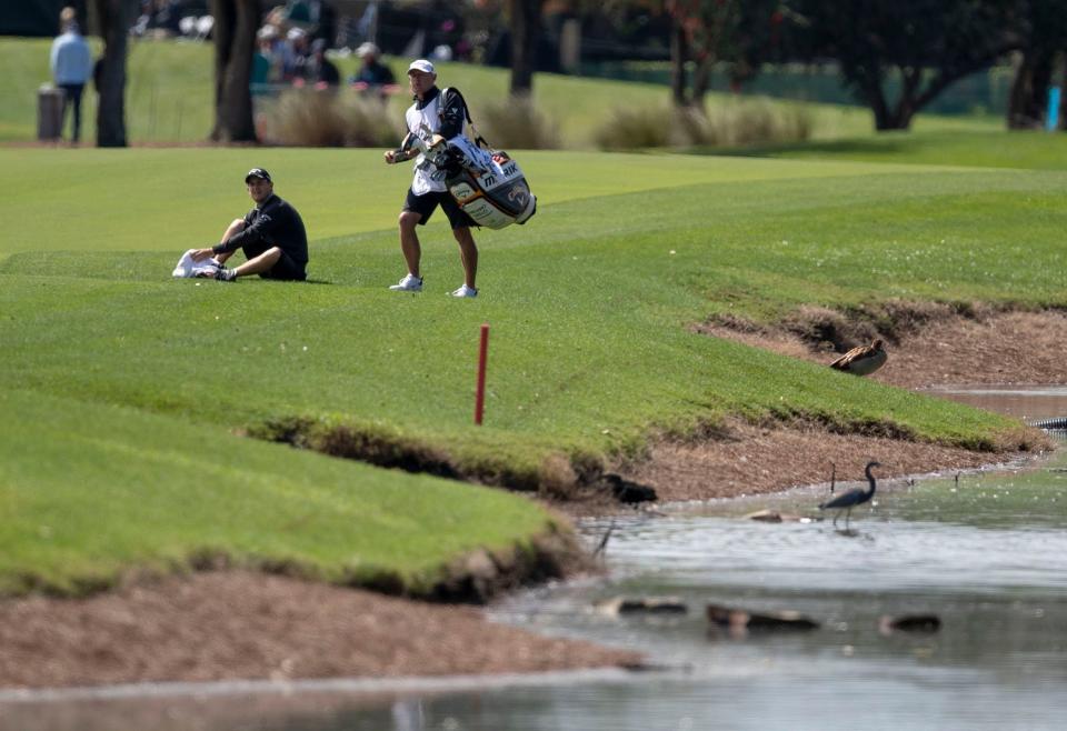There is plenty of water around the Champion course and Emiliano Grillo, drying off after hitting out of the water along the 6th fairway at the Honda Classic in 2020, will attest to that.