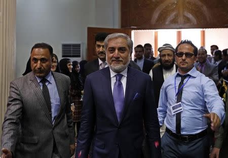 The runner-up in Afghanistan's disputed election, Abdullah Abdullah, (C) arrives to speak to his supporters in Kabul September 25, 2014. REUTERS/Mohammad Ismail