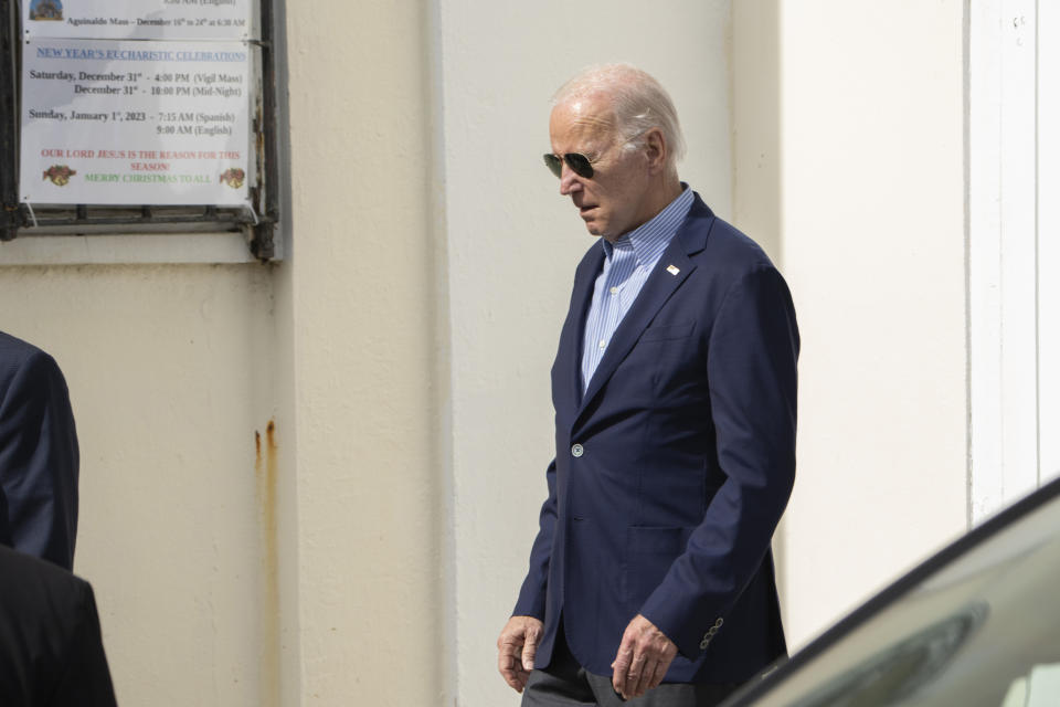 President Joe Biden, leaves Holy Cross Catholic Church in Christiansted, U.S. Virgin Islands, after attending a Mass, on Sunday, Jan. 1, 2023. (AP Photo/Manuel Balce Ceneta)