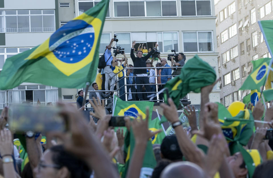 President Jair Bolsonaro greets supporters in Copacabana beach during the celebrations of the bicentennial of the country's independence in Rio de Janeiro, Brazil, Wednesday, Sept. 7, 2022. (AP Photo/Rodrigo Abd)