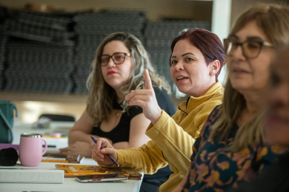 Natalia Santos, center, speaks during an in-person morning Framingham Adult ESL+ class in March. The program has expanded to Milford.